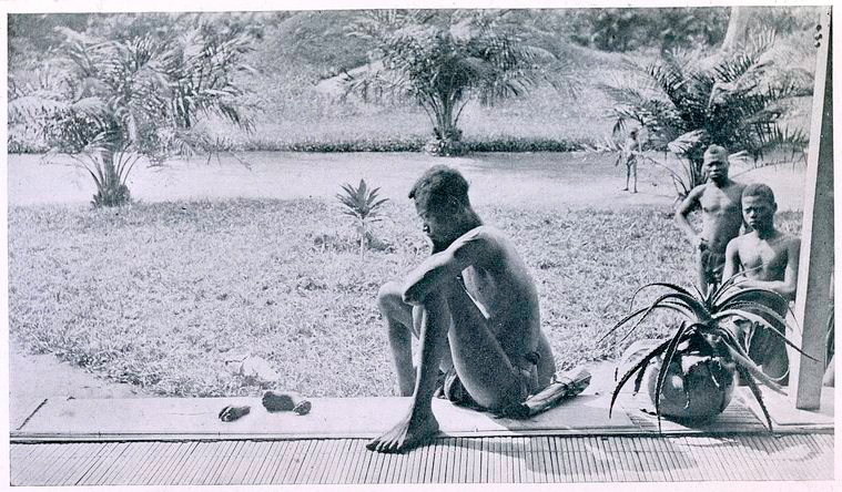 Nsala_of_Wala_in_Congo_looks_at_the_severed_hand_and_foot_of_his_five-year_old_daughter,_1904