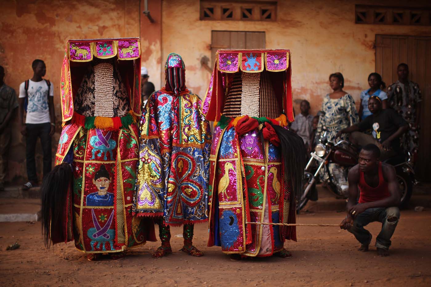 OUIDAH, BENIN - JANUARY 11: Egungun spirits perform during a Voodoo ceremony on January 11, 2012 in Ouidah, Benin. The Egungun are masqueraded dancers that represents the ancestral spirits of the Yoruba, a Nigerian ethnic group, and are believed to visit earth to possess and give guidance to the living. Ouidah is Benin's Voodoo heartland, and thought to be the spiritual birthplace of Voodoo or Vodun as it known in Benin. Shrouded in mystery and often misunderstood, Voodoo was acknowledged as an official religion in Benin in 1989, and is increasing in popularity with around 17 percent of the population following it. A week of activity centred around the worship of Voodoo culminates on the 10th of January when people from across Benin as well as Togo and Nigeria decend on the town for the annual Voodoo festival.  (Photo by Dan Kitwood/Getty Images) ORG XMIT: 136723721